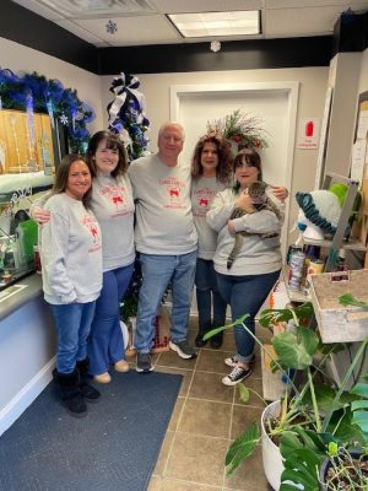 Meet the office staff (from left to right) Amy, Chandler, Mr. Jessie, and Haley (with Meter our office cat)